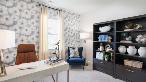 Study with natural lighting and carpet flooring