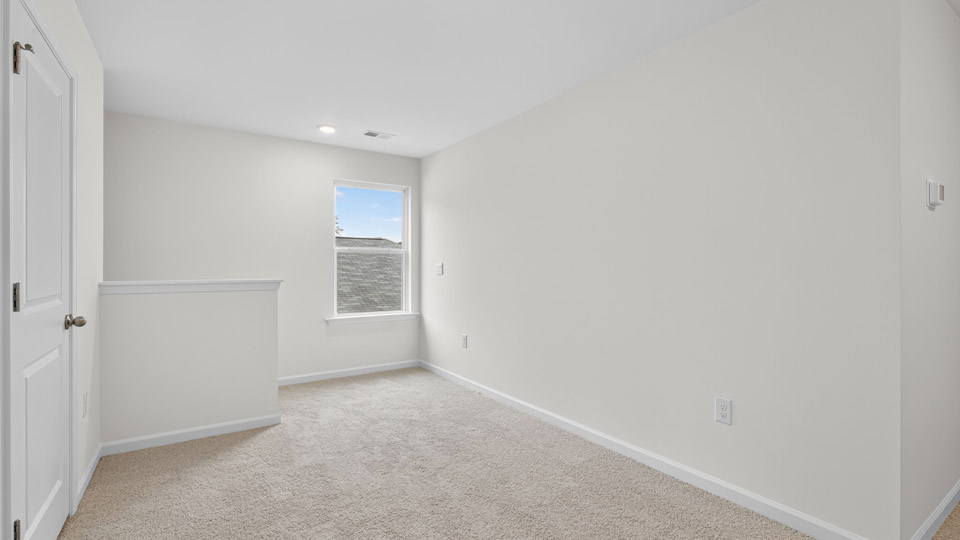 loft with carpet flooring