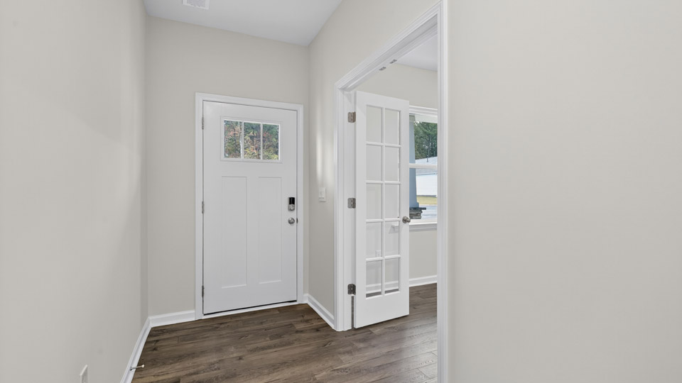foyer entryway with revwood flooring