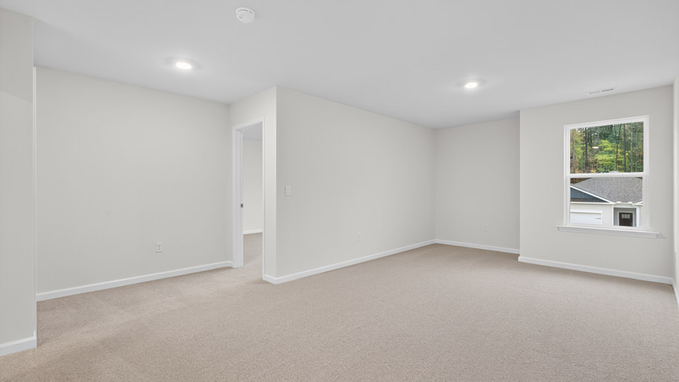 loft with carpet flooring