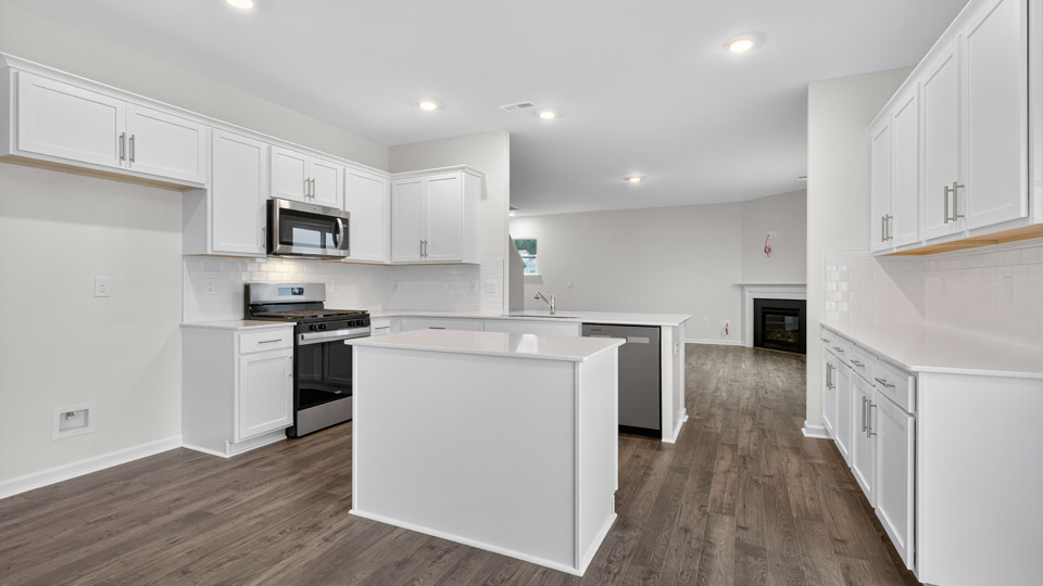 kitchen with white cabinets quartz countertops and stainless steel appliances