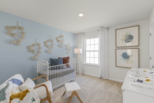 Bedroom with natural lighting and carpet flooring