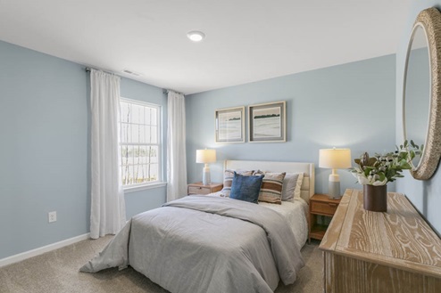 Bedroom with natural lighting and carpet flooring