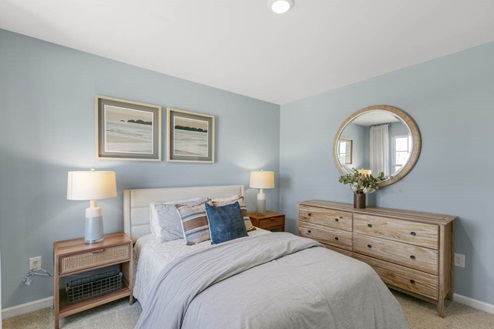 Bedroom with natural lighting and carpet flooring