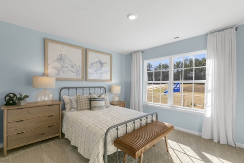 Bedroom with natural lighting and carpet flooring