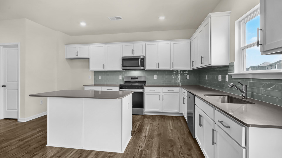 Columbia Kitchen with quartz countertops and stainless steel appliances