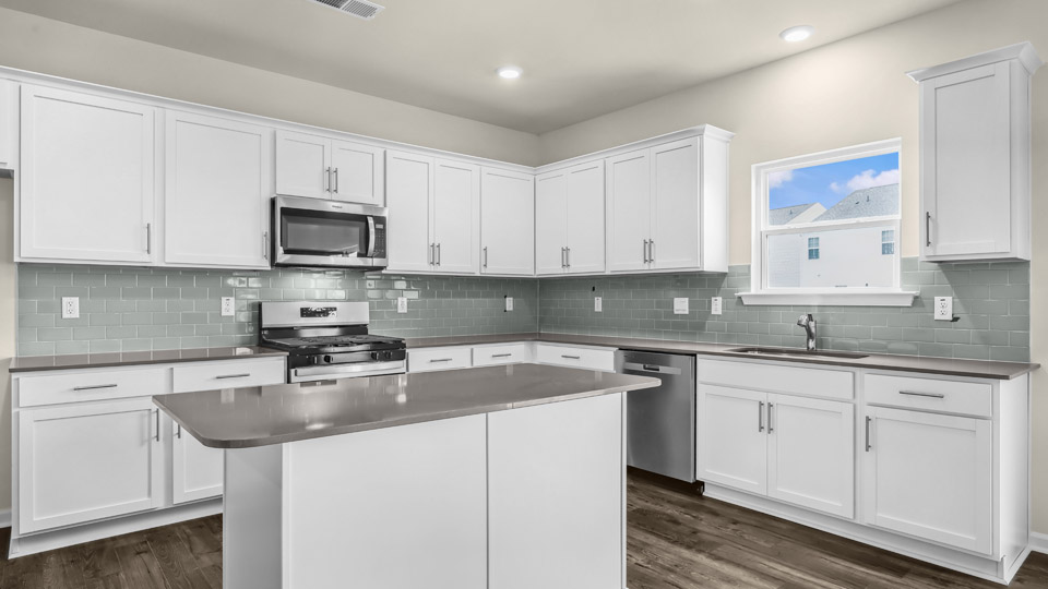 Columbia Kitchen with quartz countertops and stainless steel appliances