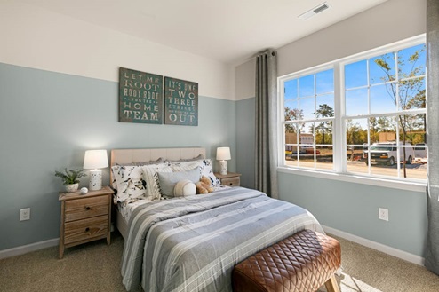 Bedroom with natural lighting and carpet flooring