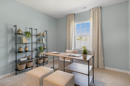 Study with ample lighting and revwood flooring