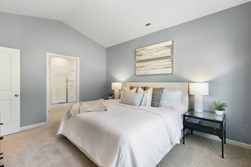 Bedroom with natural lighting and carpet flooring