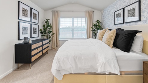 Bedroom with natural lighting and carpet flooring