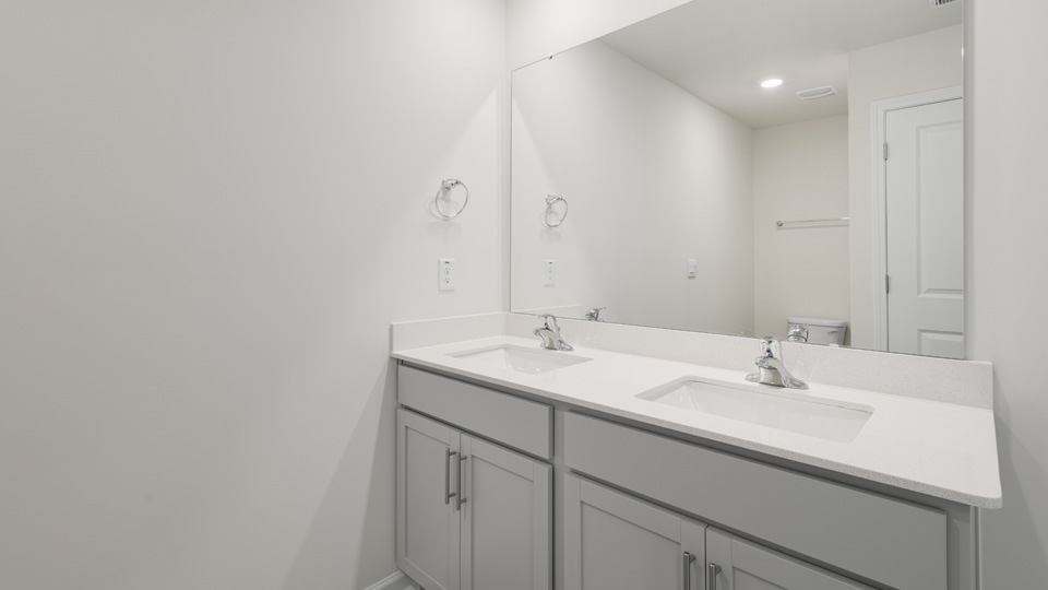 Bathroom with grey cabinets