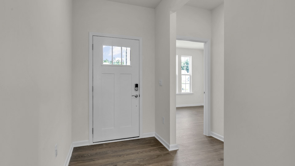 foyer and entryway with revwood flooring