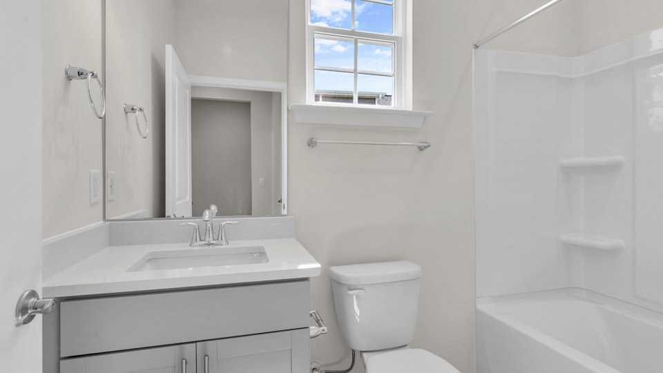 bathroom with quartz countertops