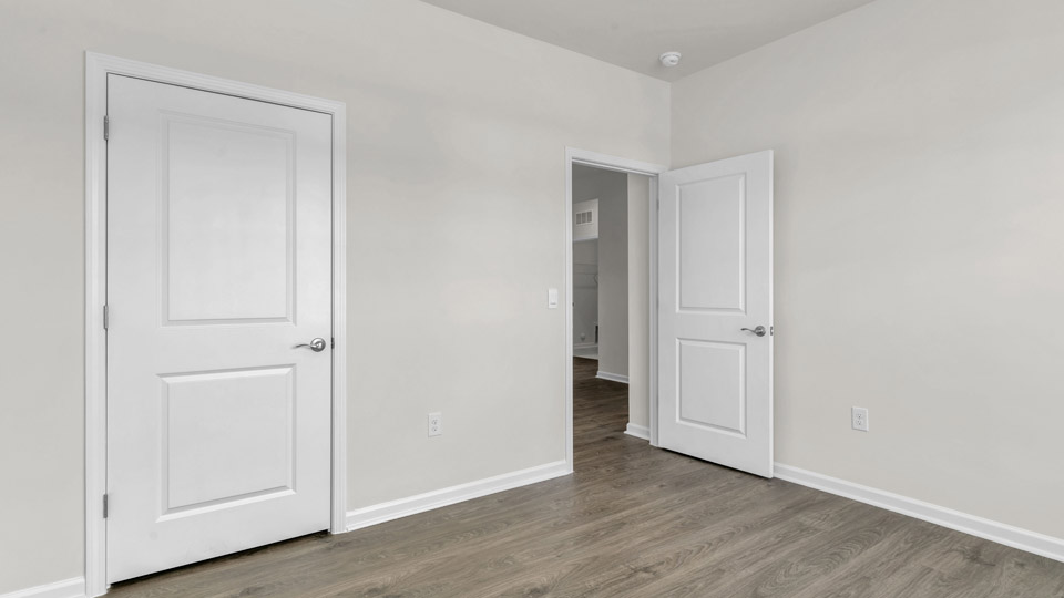 bedroom with revwood flooring