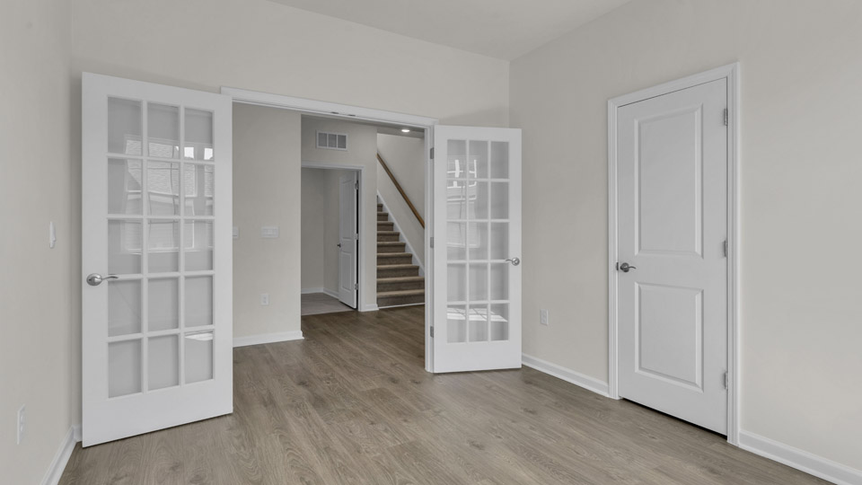 study with french doors and revwood flooring