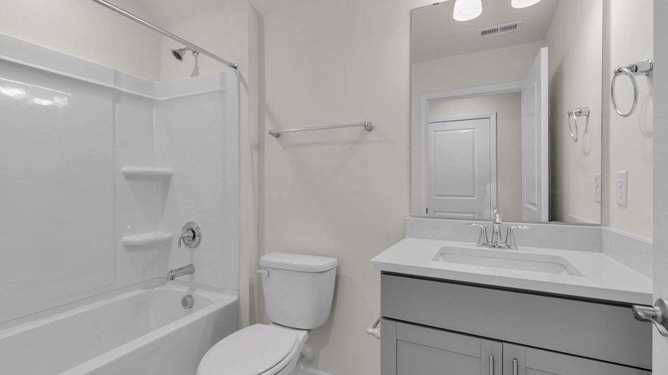 bathroom with quartz countertops