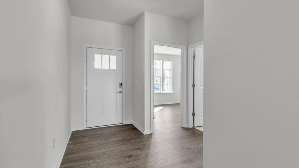 foyer entryway with revwood flooring