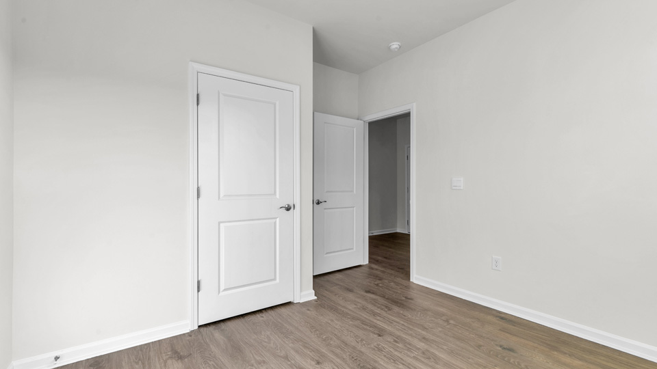bedroom with revwood flooring