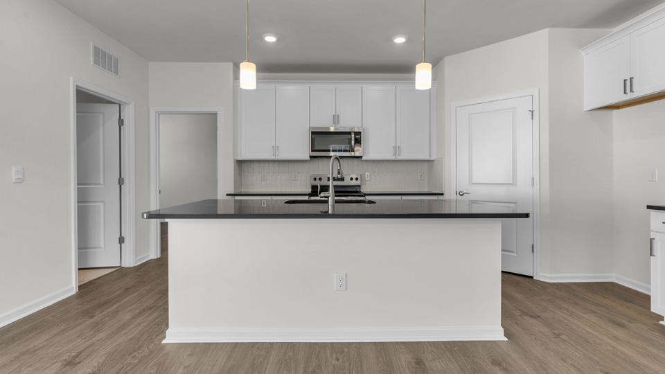 kitchen with white cabinets and quartz countertops