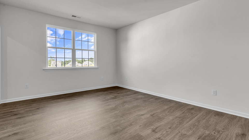 bedroom with revwood flooring