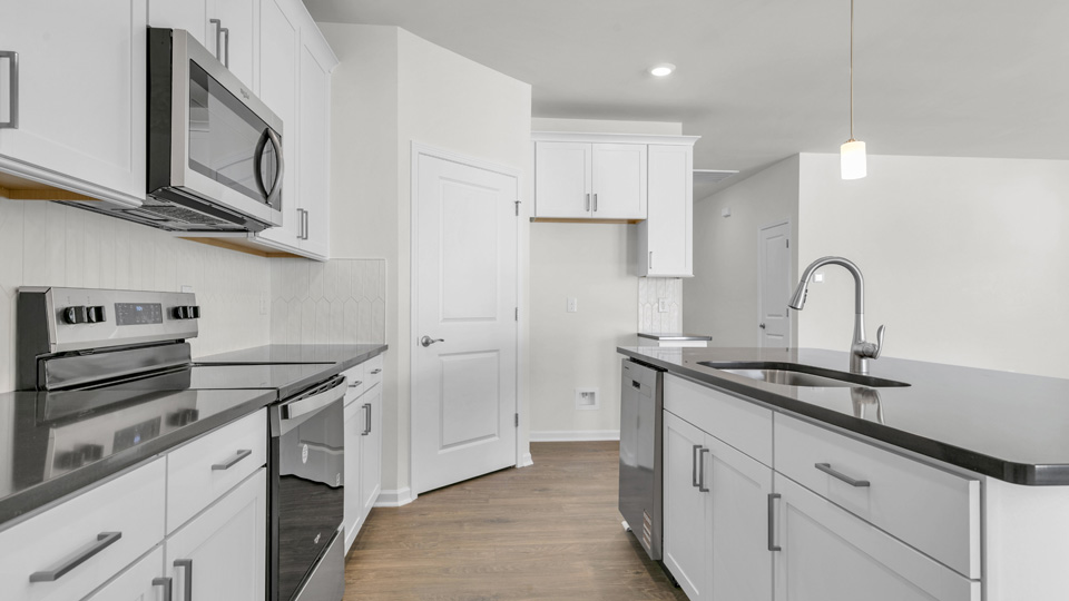 kitchen with white cabinets and quartz countertops