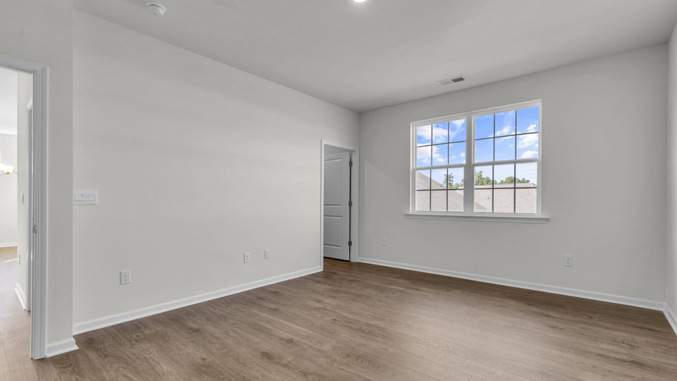 bedroom with revwood flooring