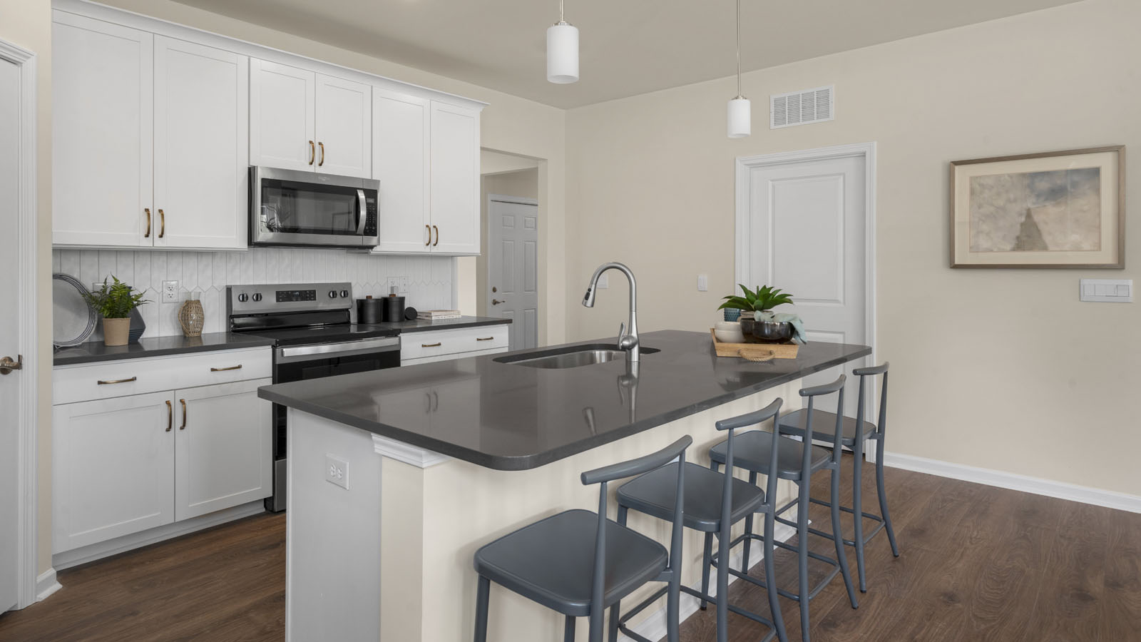 kitchen with white cabinets and quartz countertops