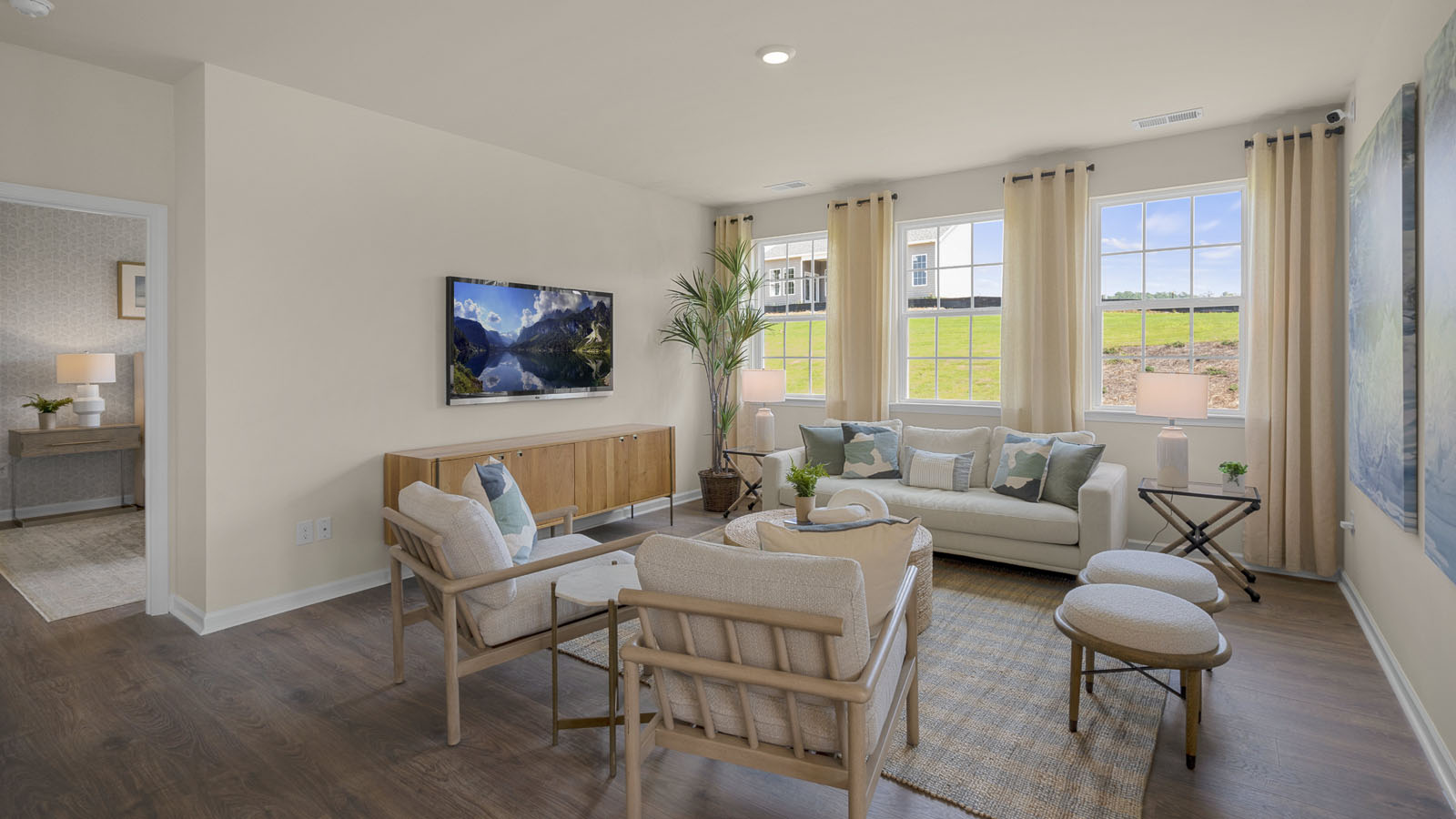 living room with no fireplace and revwood flooring