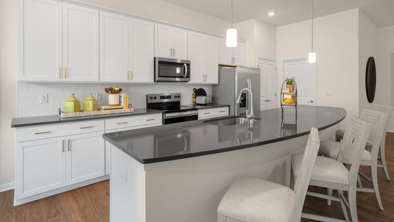 kitchen with white cabinets and quartz countertops