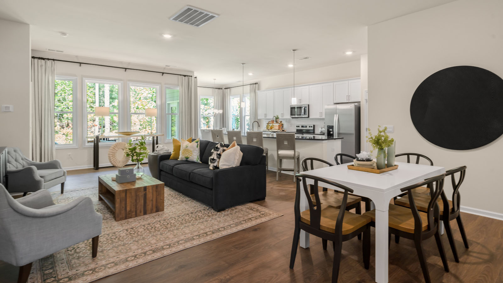 living room and dining area with revwood flooring