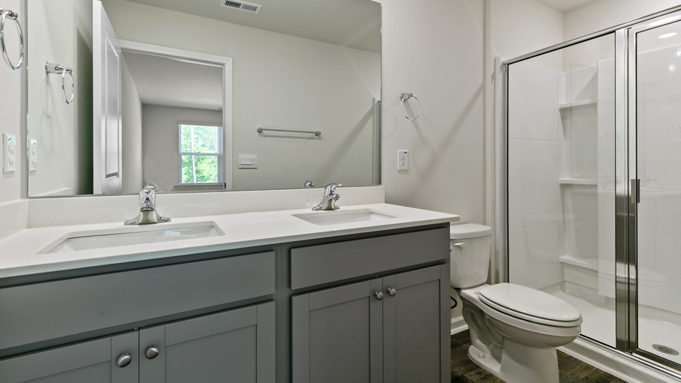 Bathroom with grey cabinets