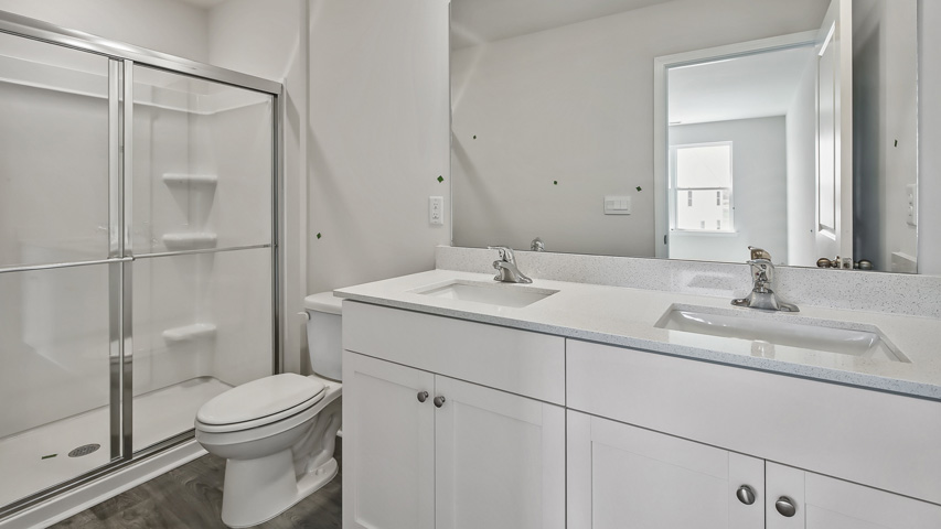 Bathroom with white cabinets