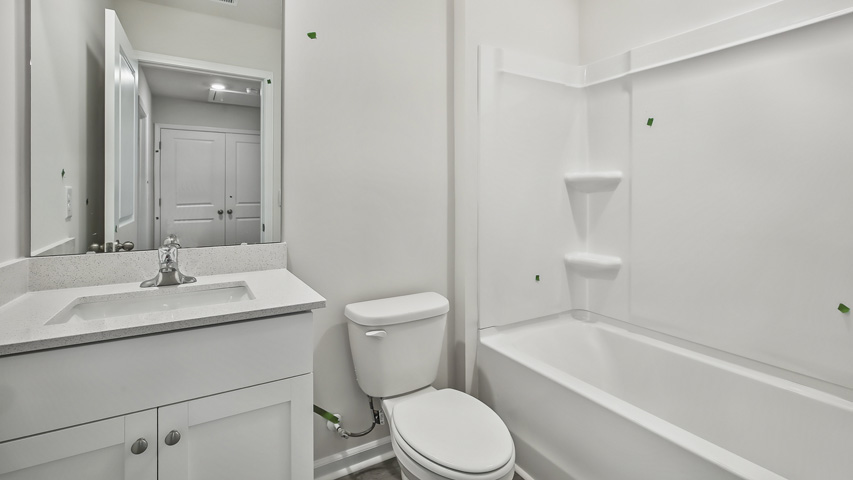 Bathroom with white cabinets