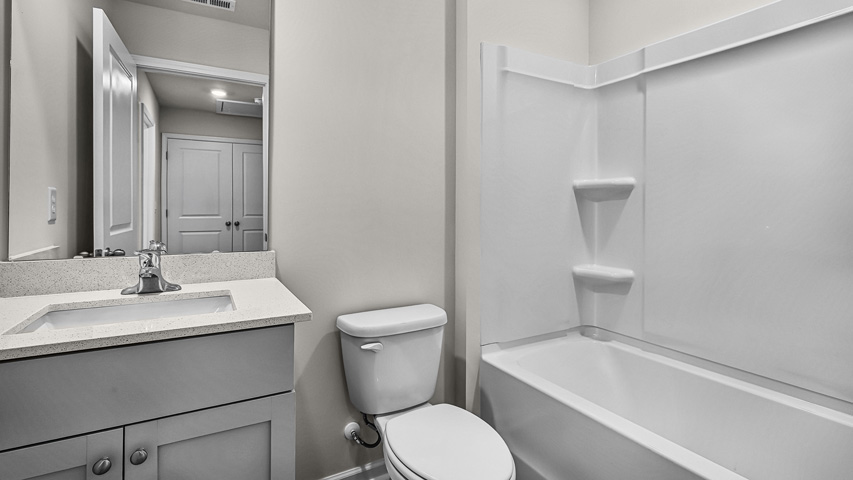 bathroom with grey cabinets