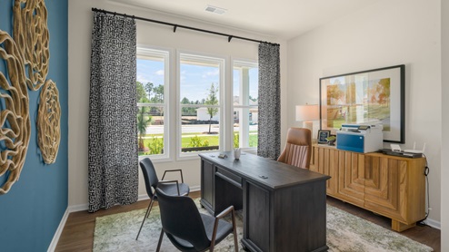 office space with revwood flooring and ample light