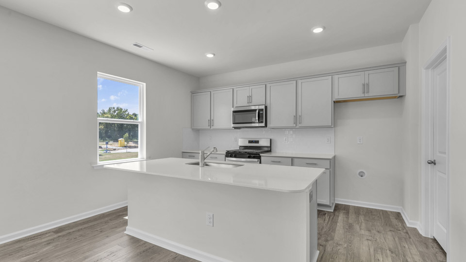 kitchen with quartz countertops and stainless steel appliances