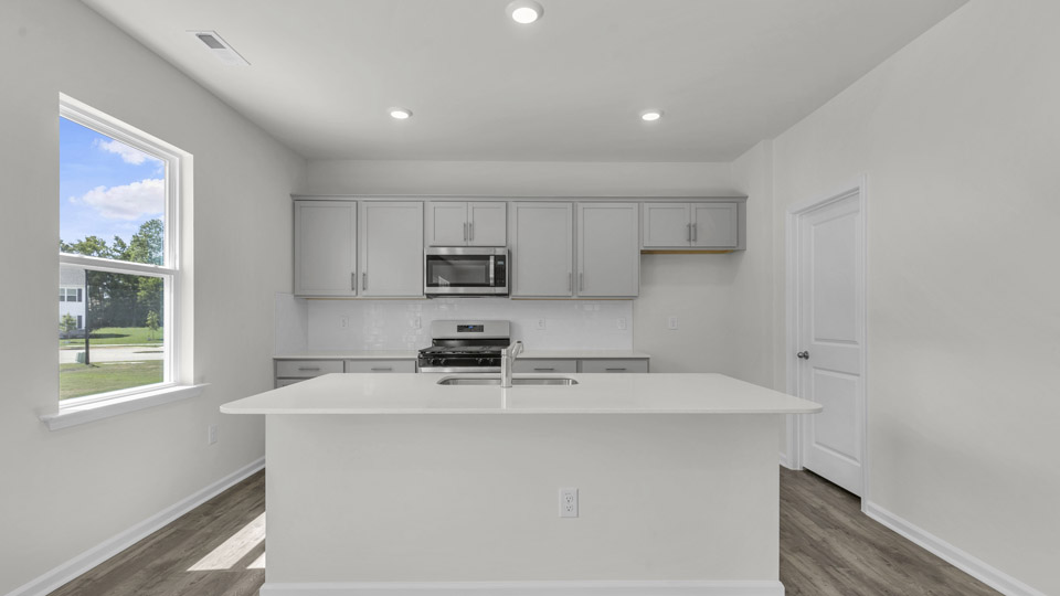 kitchen with quartz countertops and stainless steel appliances