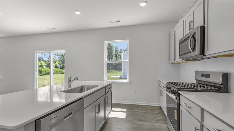 kitchen with quartz countertops and stainless steel appliances