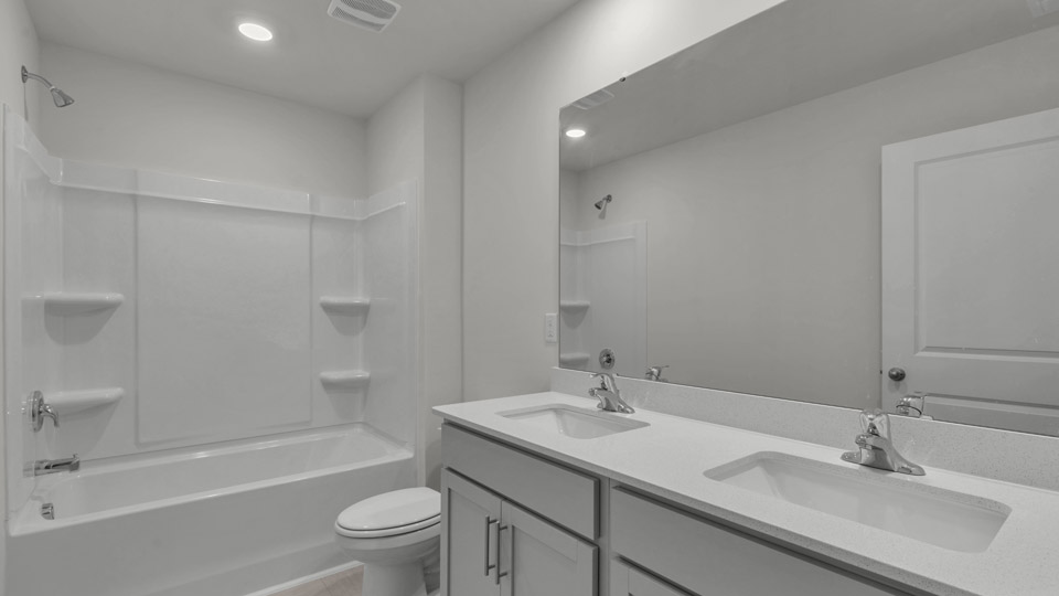 bathroom with quartz countertops