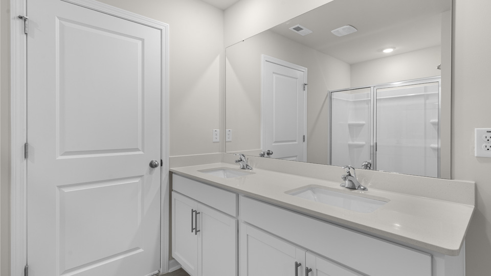 Bathroom with white cabinets