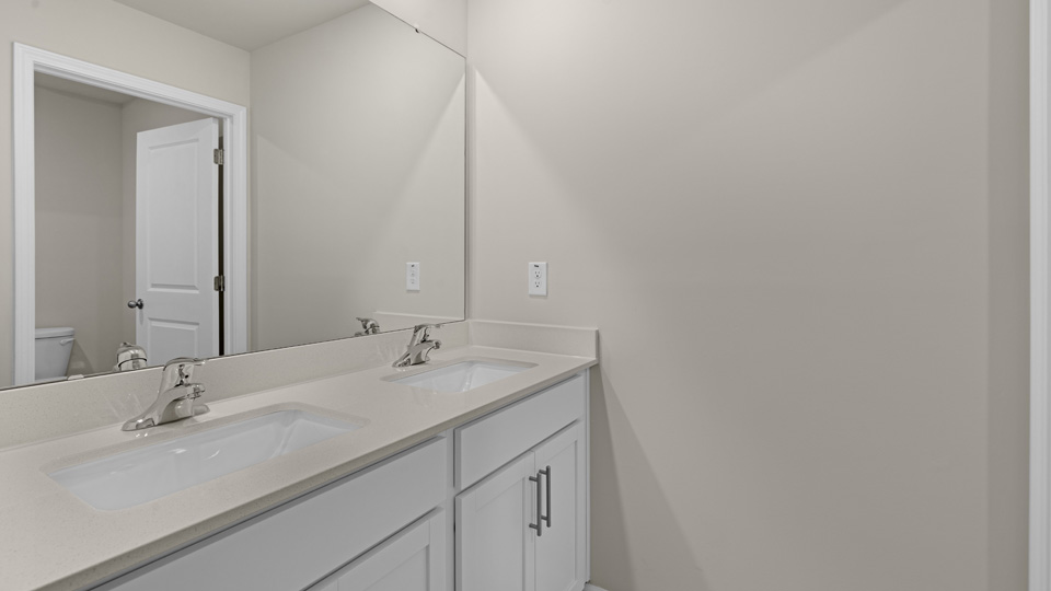 Bathroom with white cabinets