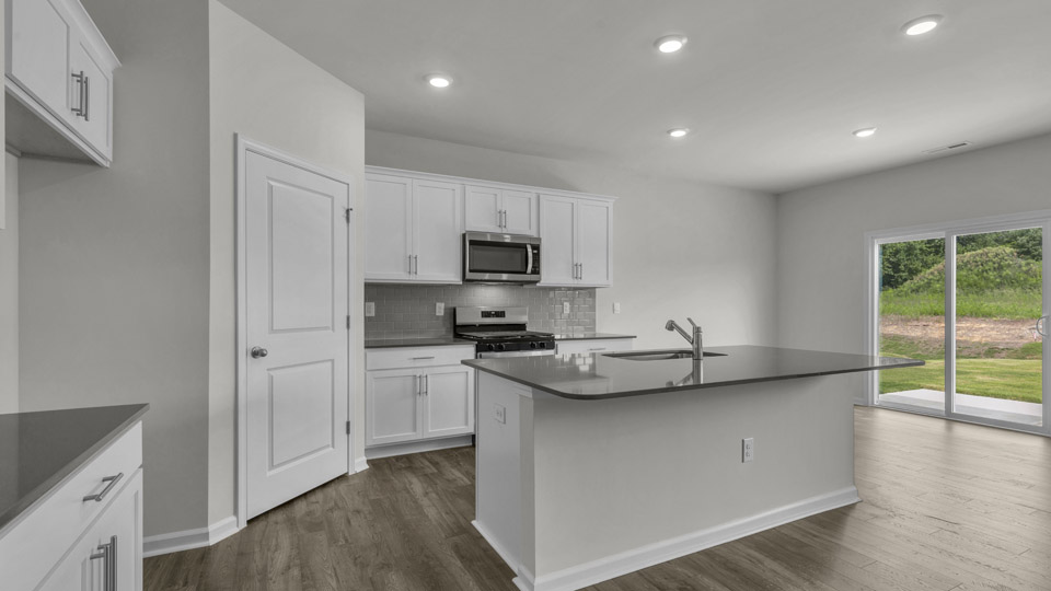 kitchen with quartz countertops and stainless steel appliances