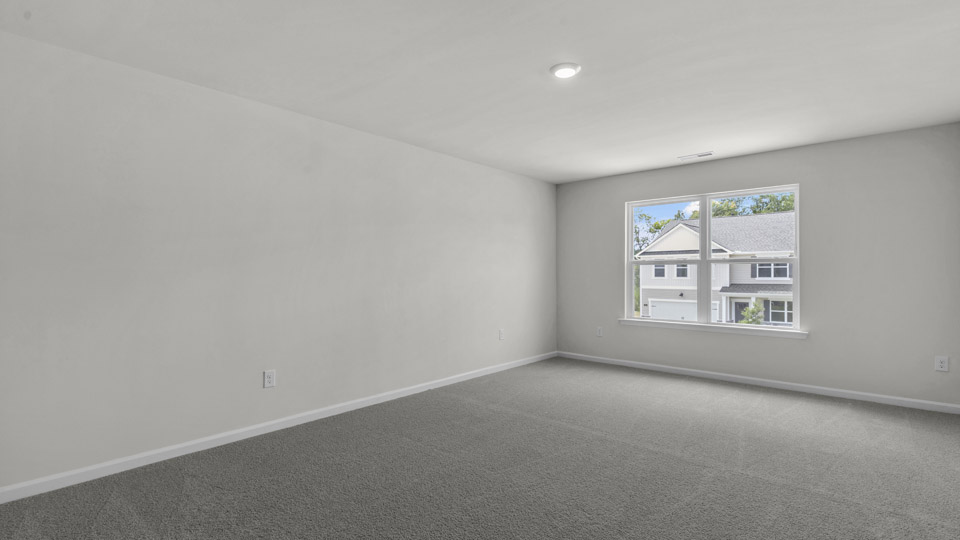 loft with carpet flooring