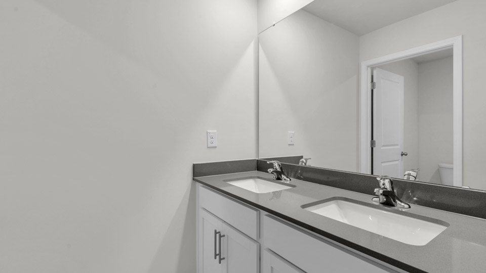 bathroom with quartz countertops