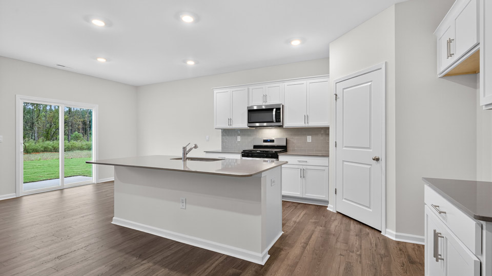 kitchen with white cabinets and quartz countertops