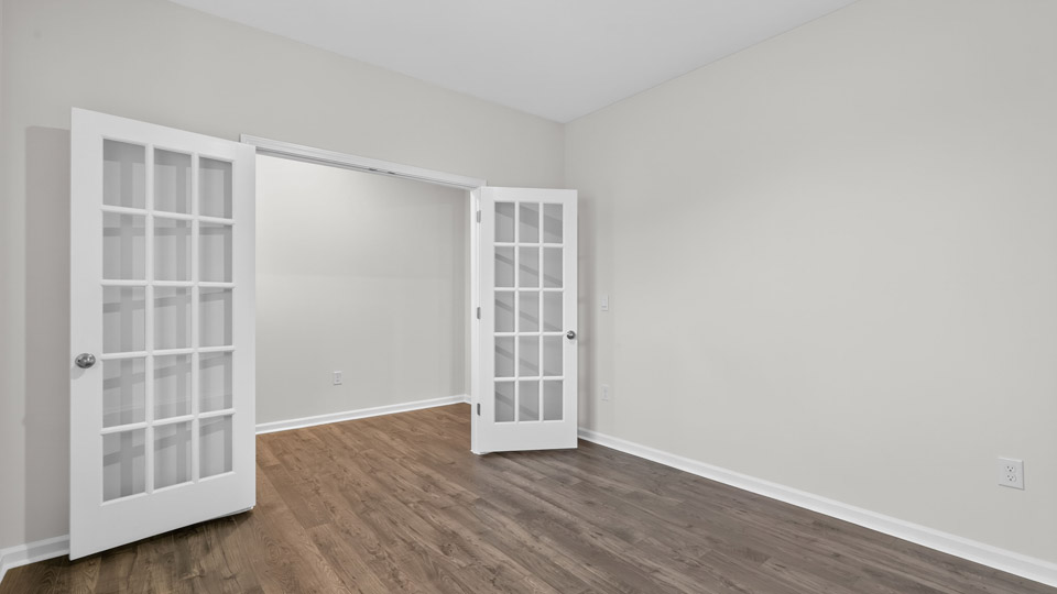 study with french doors and revwood flooring