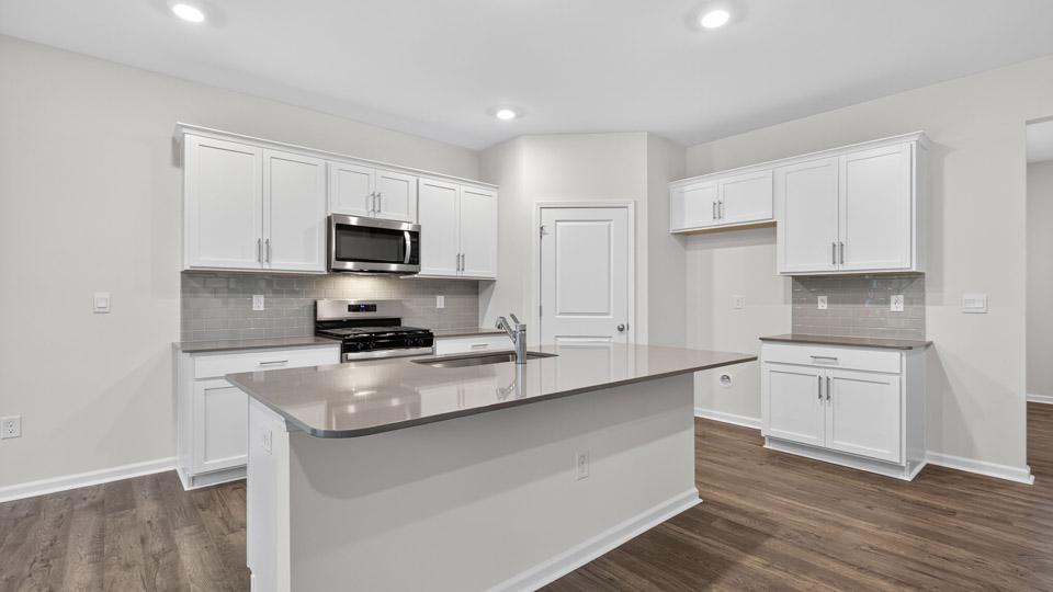 kitchen with white cabinets and quartz countertops