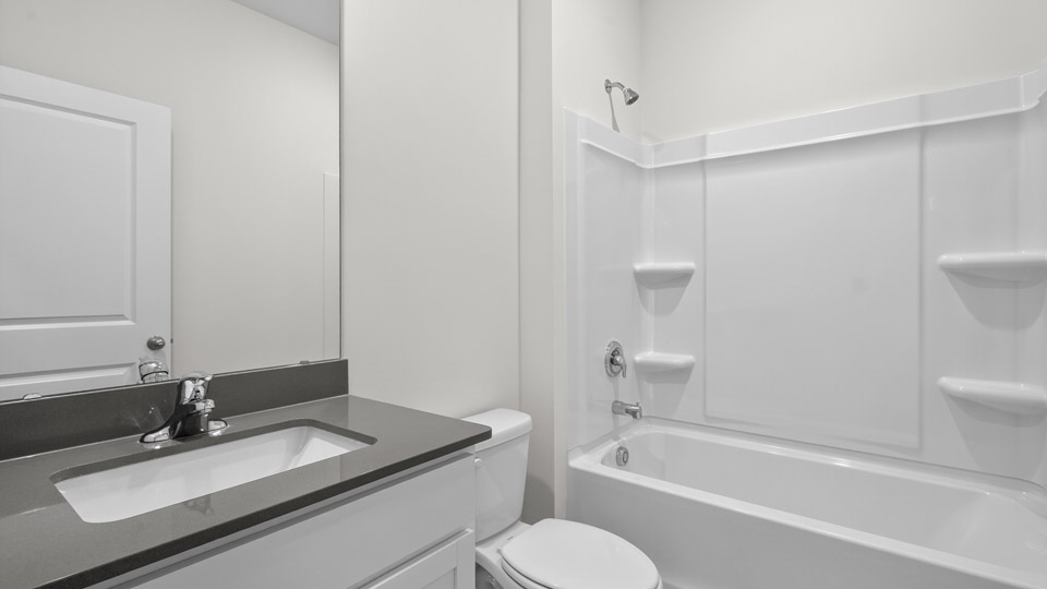 bathroom with quartz countertops