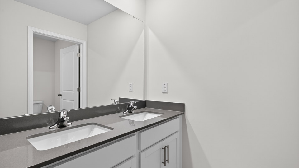 bathroom with quartz countertops